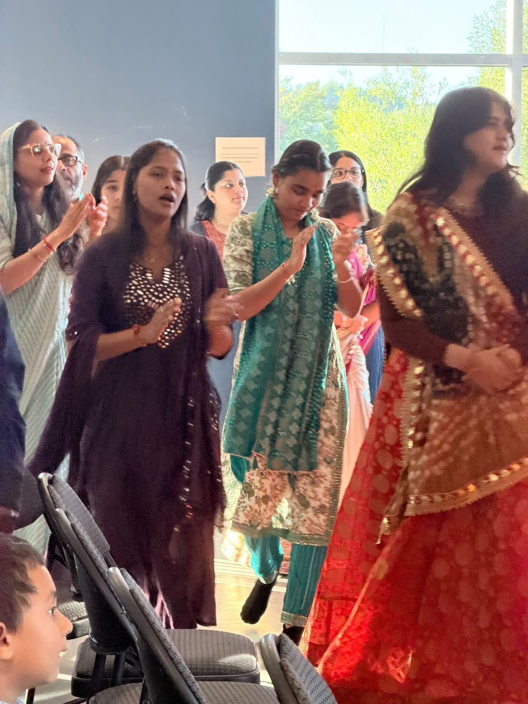 Guests singing and dancing together in the hall